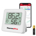 Silver digital hygrometer on stand display showing 86.2°F and 56% humidity