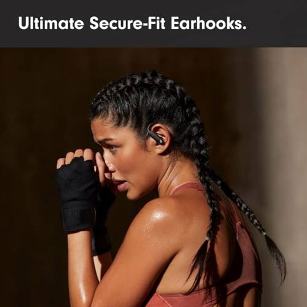 Black wireless earbuds with secure-fit earhooks worn in a workout-ready fit