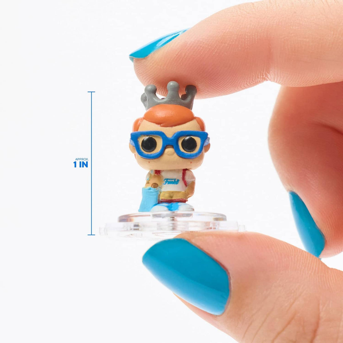 Small character figure with blue goggles and orange head, on clear plastic base