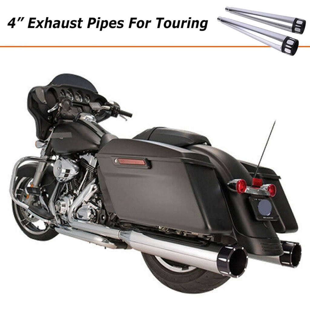 Chrome 4-inch exhaust muffler slip-ons mounted on a touring motorcycle, rear-side view
