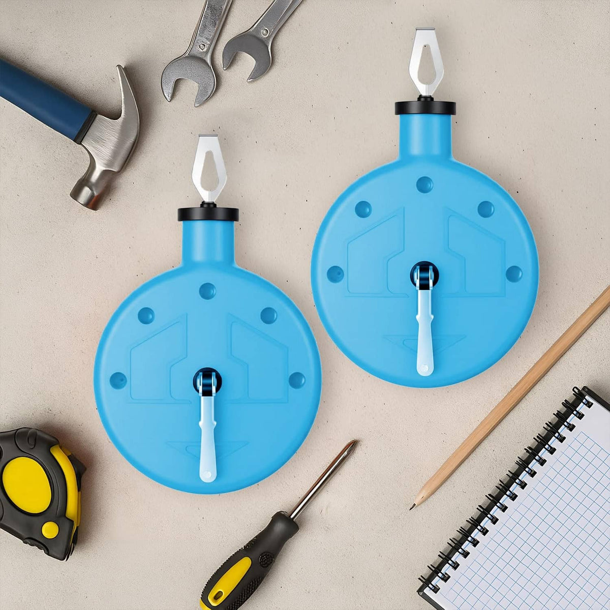 Two blue chalk line reel tools with metal hooks, top-down view of set