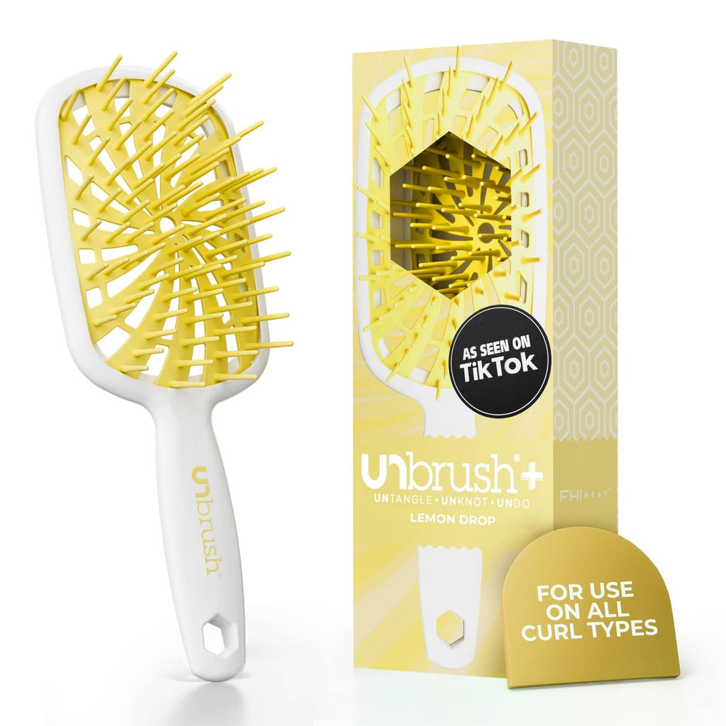 UNbrush detangling hair brush with white handle and yellow flexible bristles