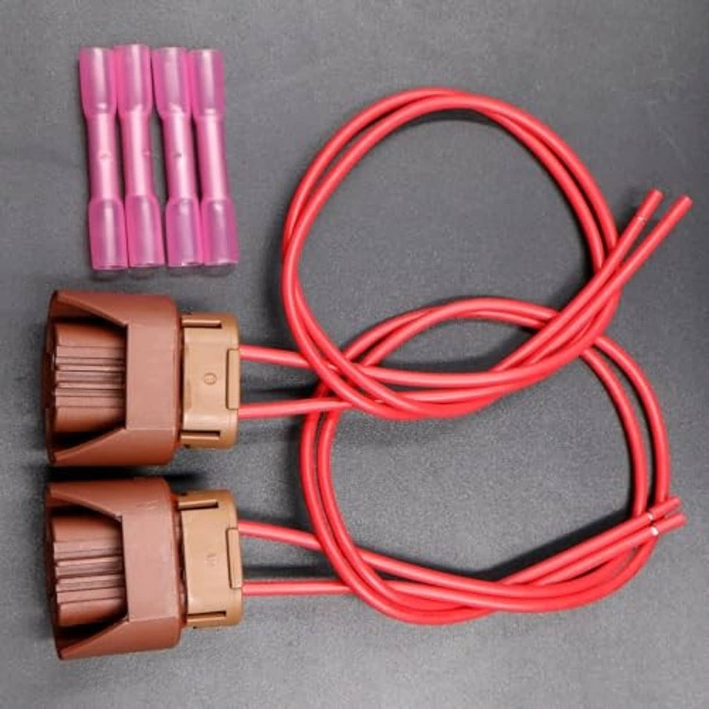 Two brown connectors with red wire harness and extra pink terminals