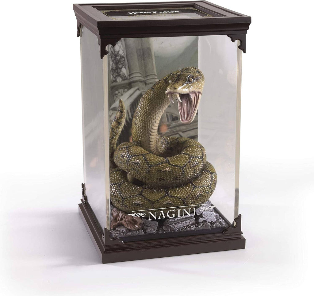 Framed glass display case featuring a coiled green snake figure with tongue