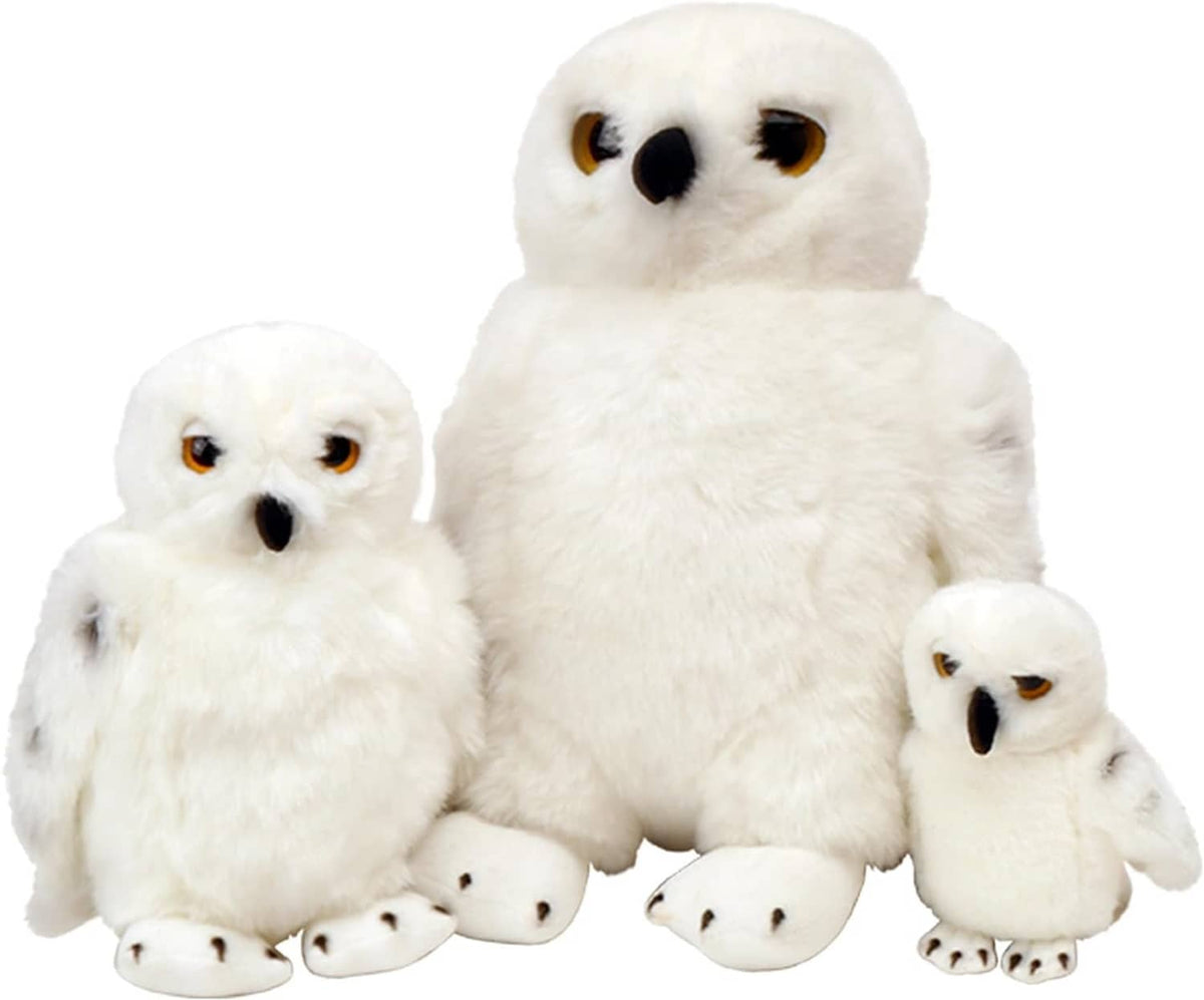 Set of plush snowy owls: one large and three smaller white owl toys