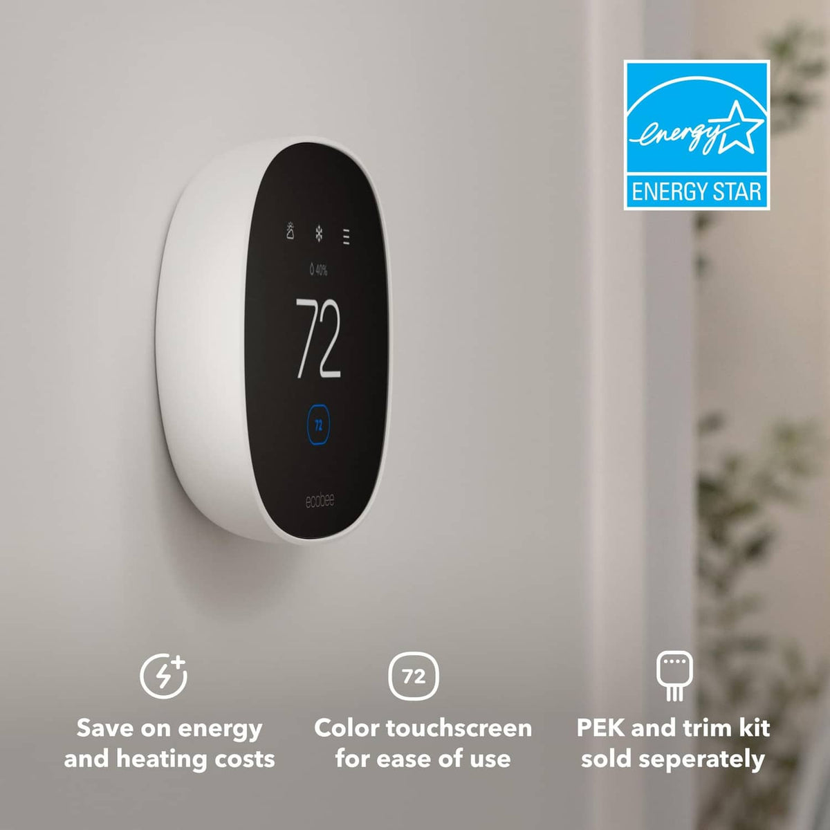 White smart thermostat mounted on wall showing temperature 72°