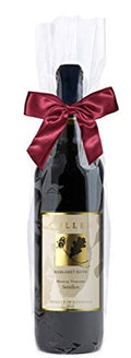 Clear cellophane bag over a wine bottle with burgundy satin ribbon bow