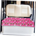 Golf cart seat cover in pink with leaf-and-dot pattern, fitted on beige seat back