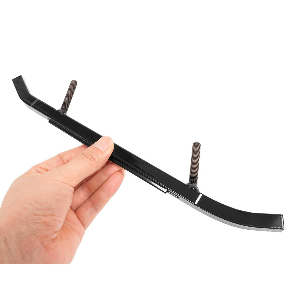Black ski wear bar with mounting posts, held by hand for scale
