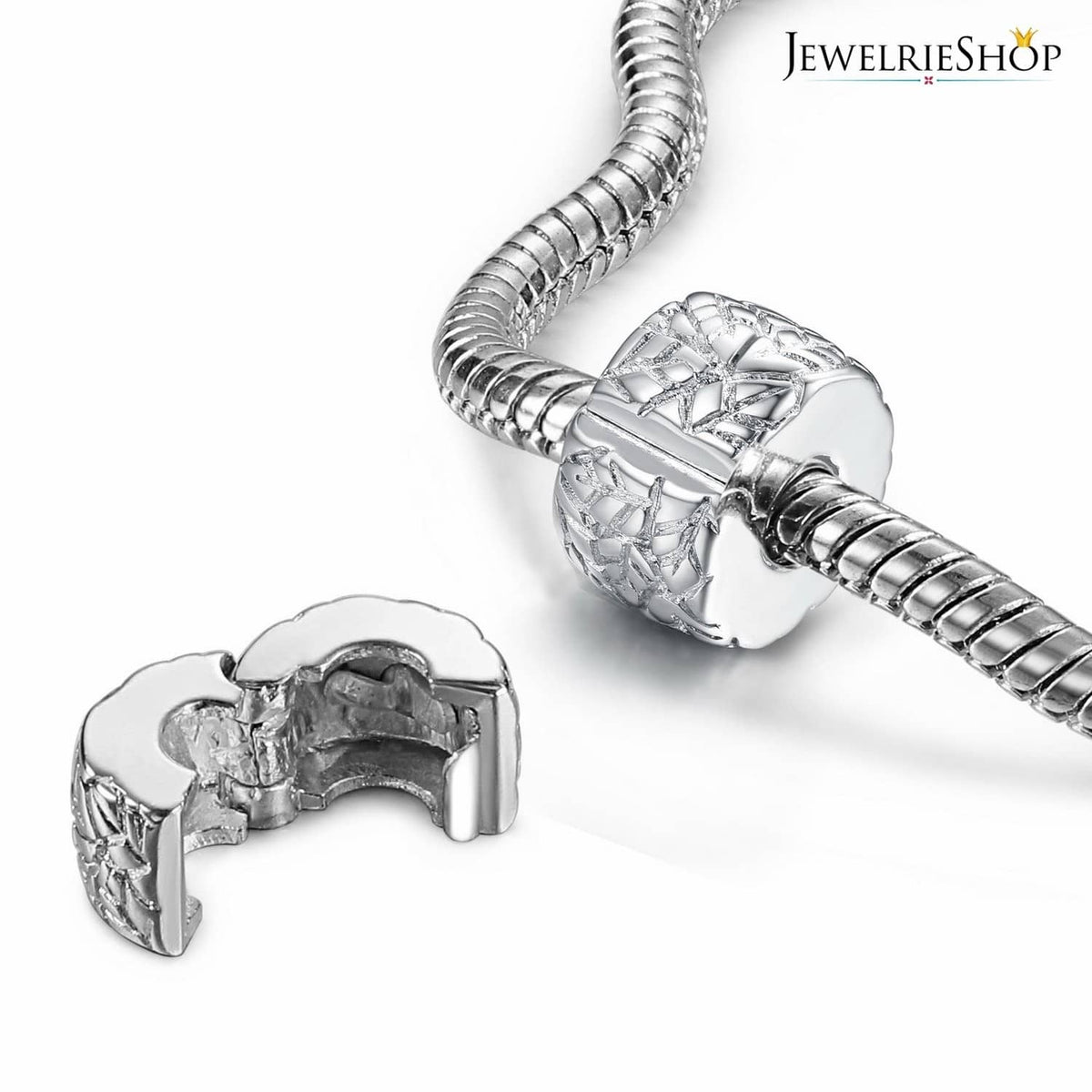 Silver round clip spacer charm bead with cutout pattern, shown near bracelet clip