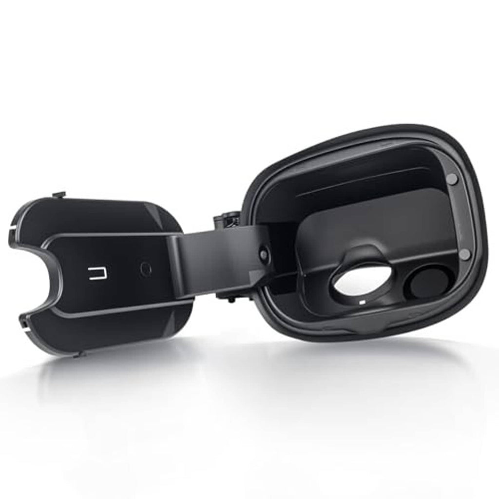 Black fuel tank filler door housing with left-side cap and circular opening