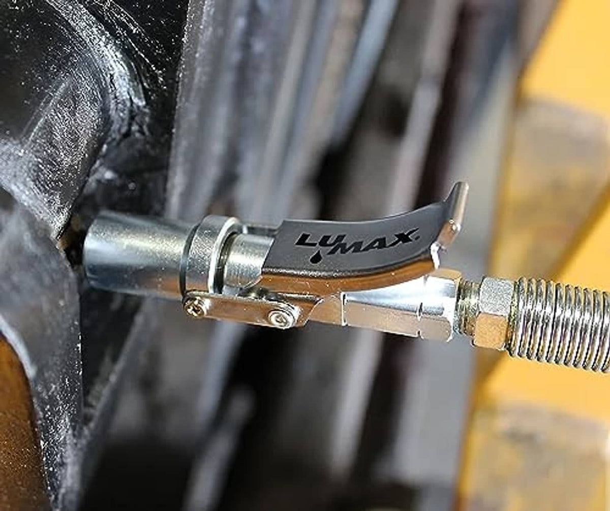 Silver quick release grease coupler attached to grease fitting with hex threaded end