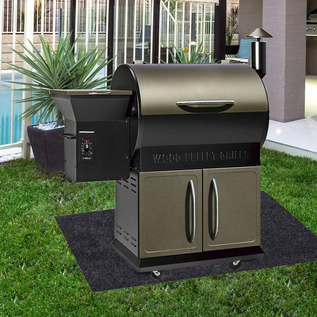 Grill mat under stainless gas grill, dark charcoal gray absorbent fabric