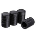 Black anodized aluminum tire valve stem caps with textured grip, 4-pack
