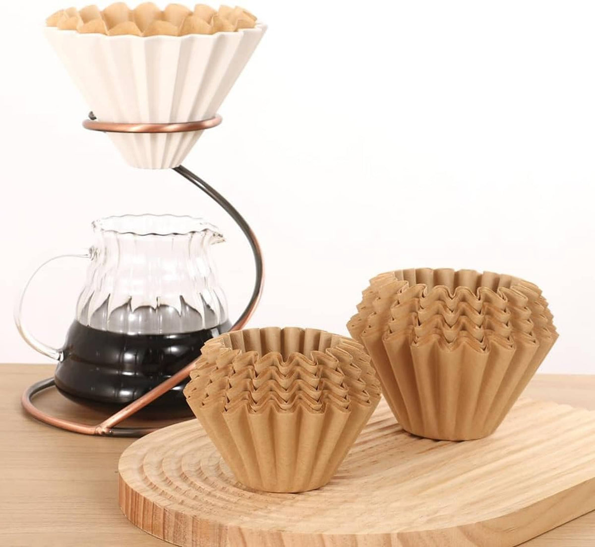 Multiple natural coffee filters on dripper stand, pleated cone shapes
