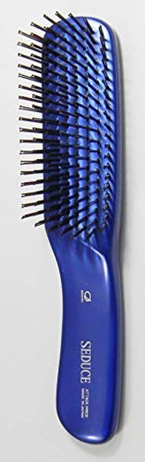 Ikemoto Seduce hair care brush, side view of blue handle and dense straight pins