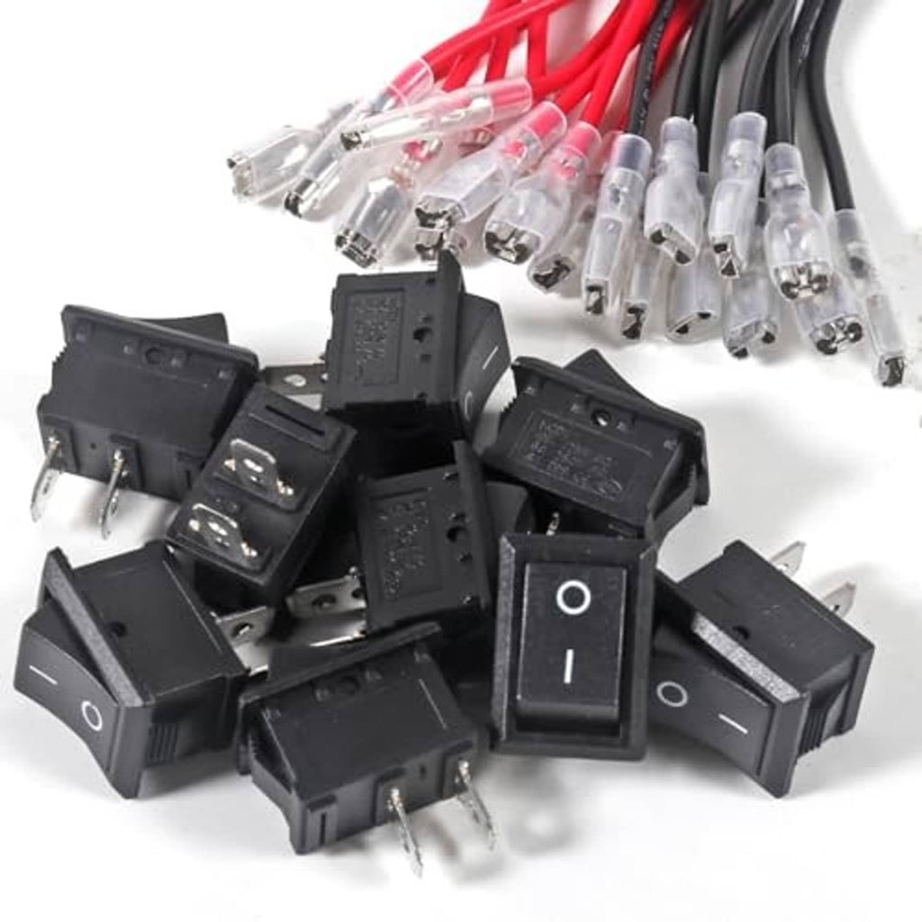 Set of black square on/off rocker switches with clear terminals and red wire harness ends