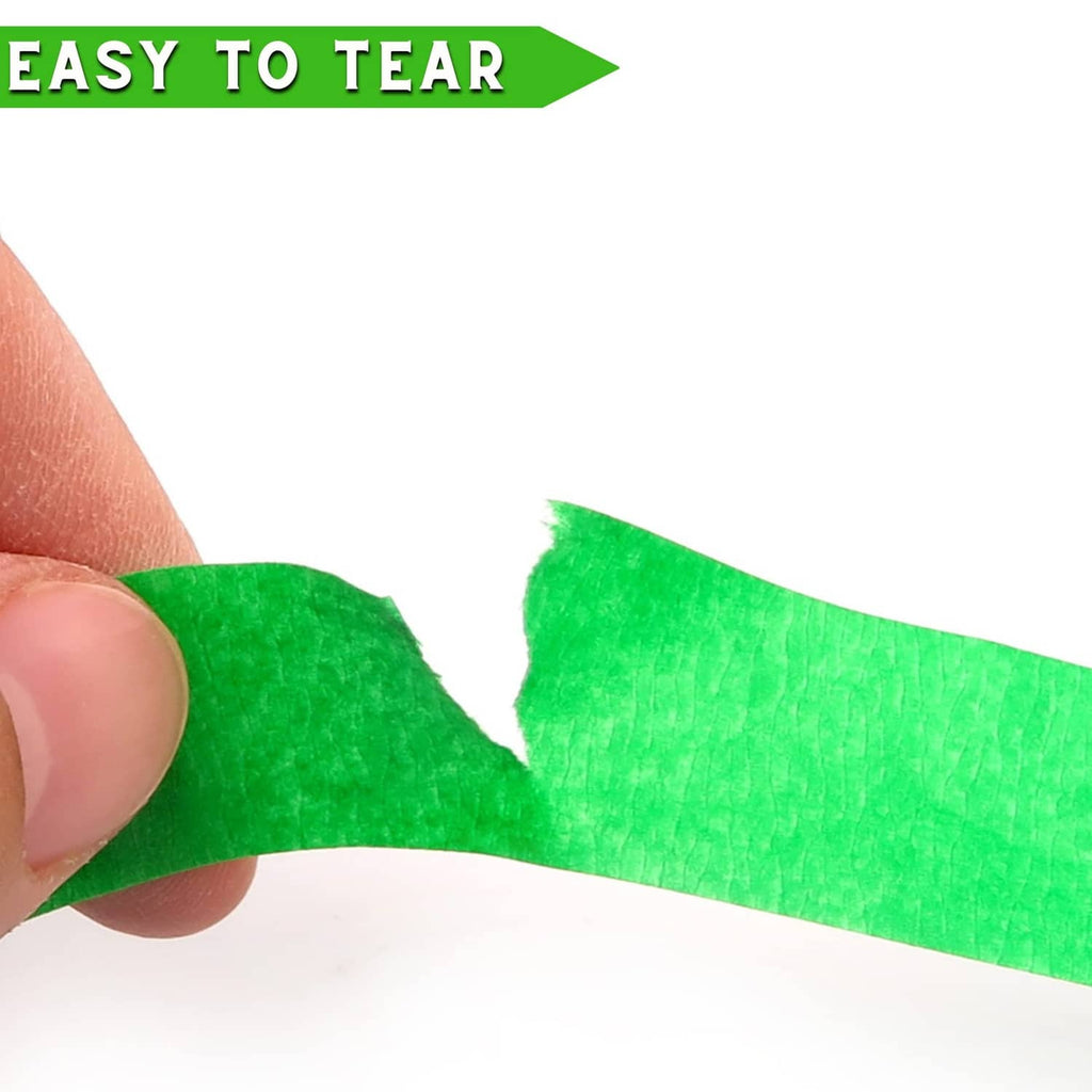 Green pinstripe tape torn by hand into a clean straight strip