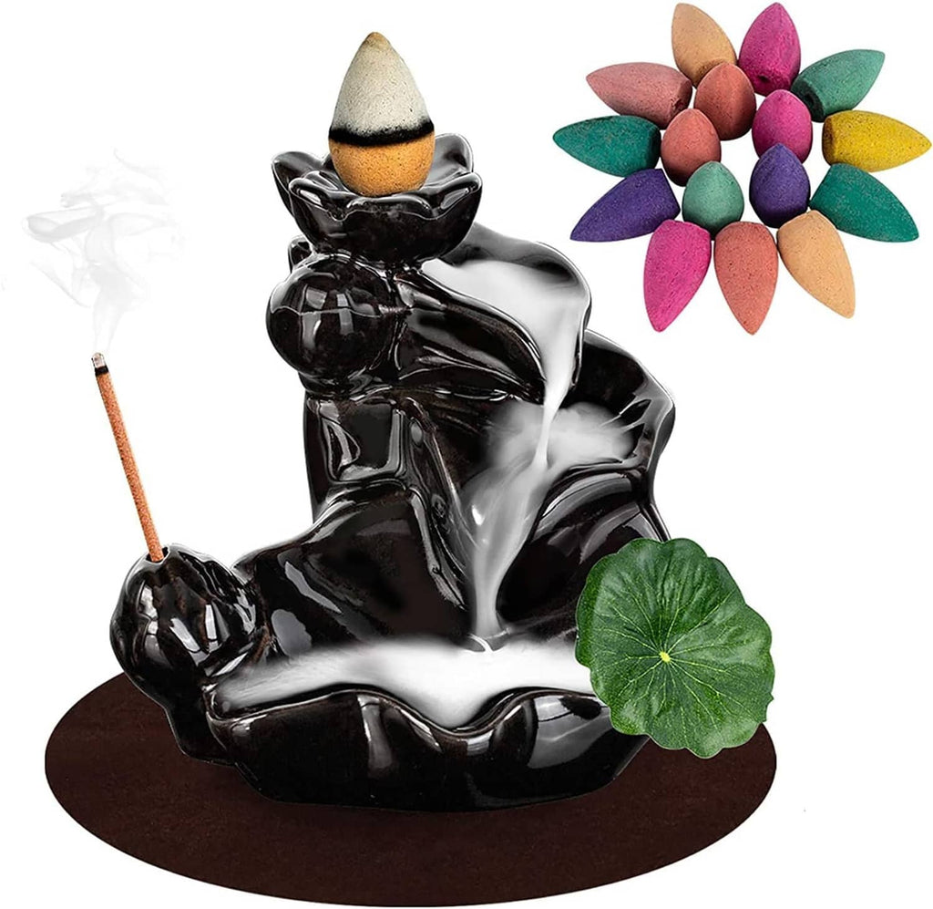 Glossy black ceramic incense burner with cone on top, incense stick, green lotus and multicolor cones