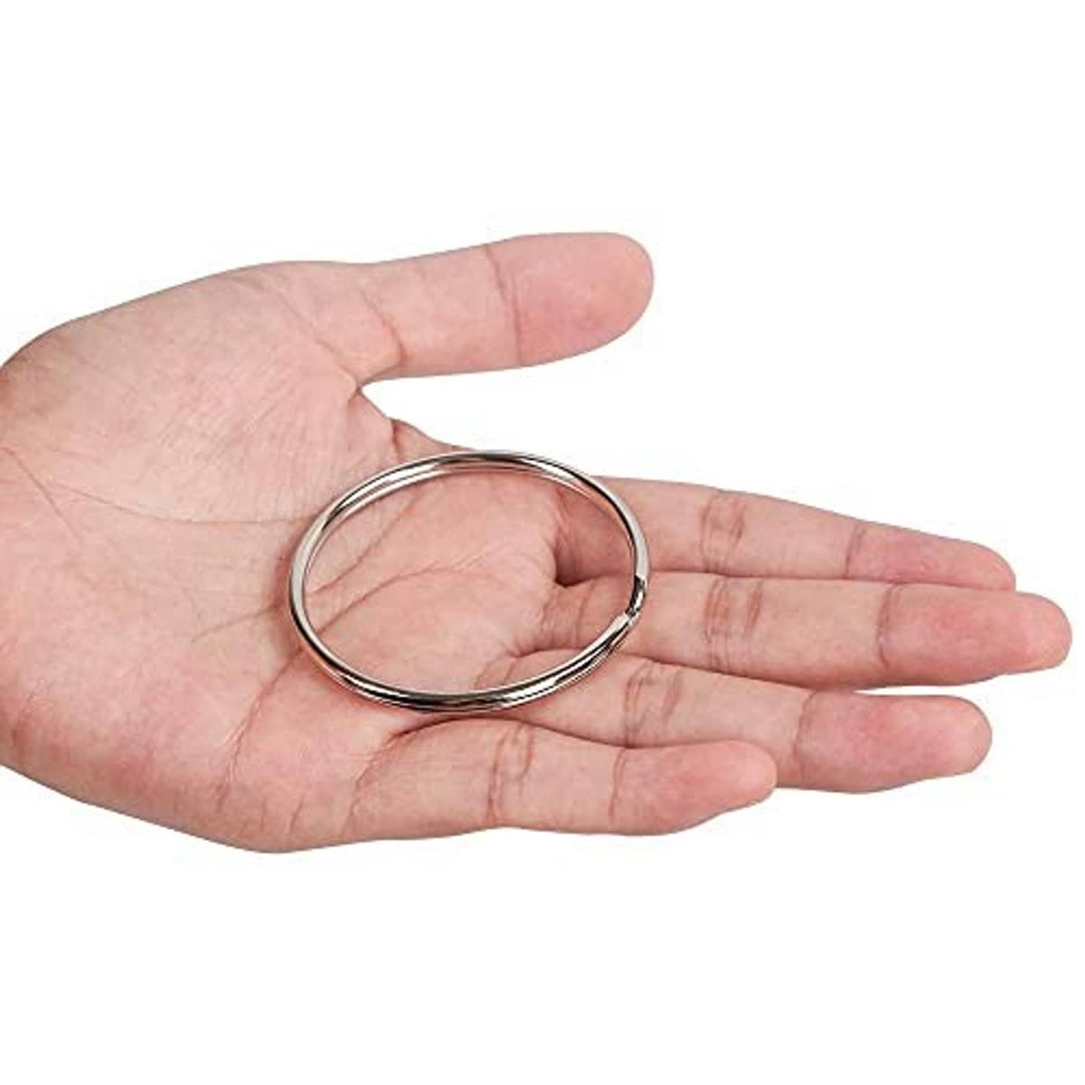 Split key ring in hand, silver metal round ring