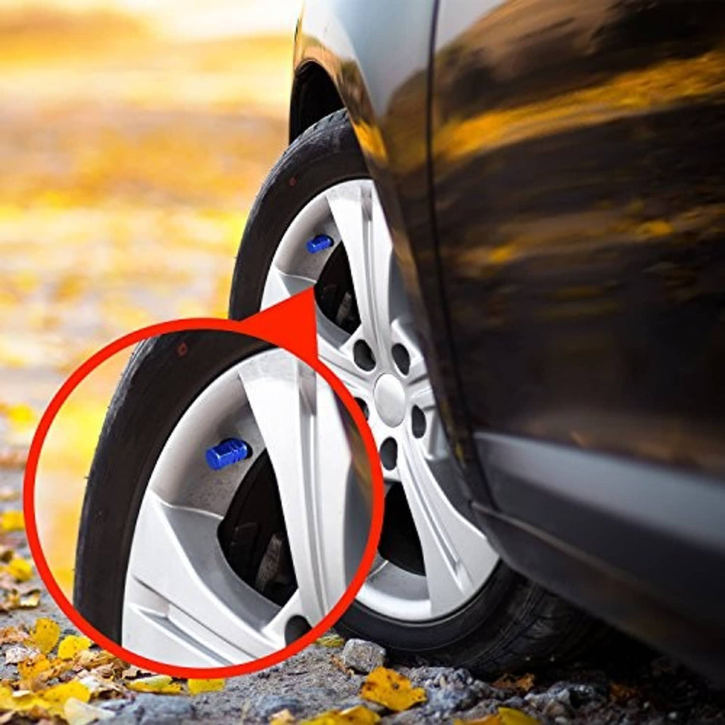 Blue tire valve stem cap installed on a car wheel