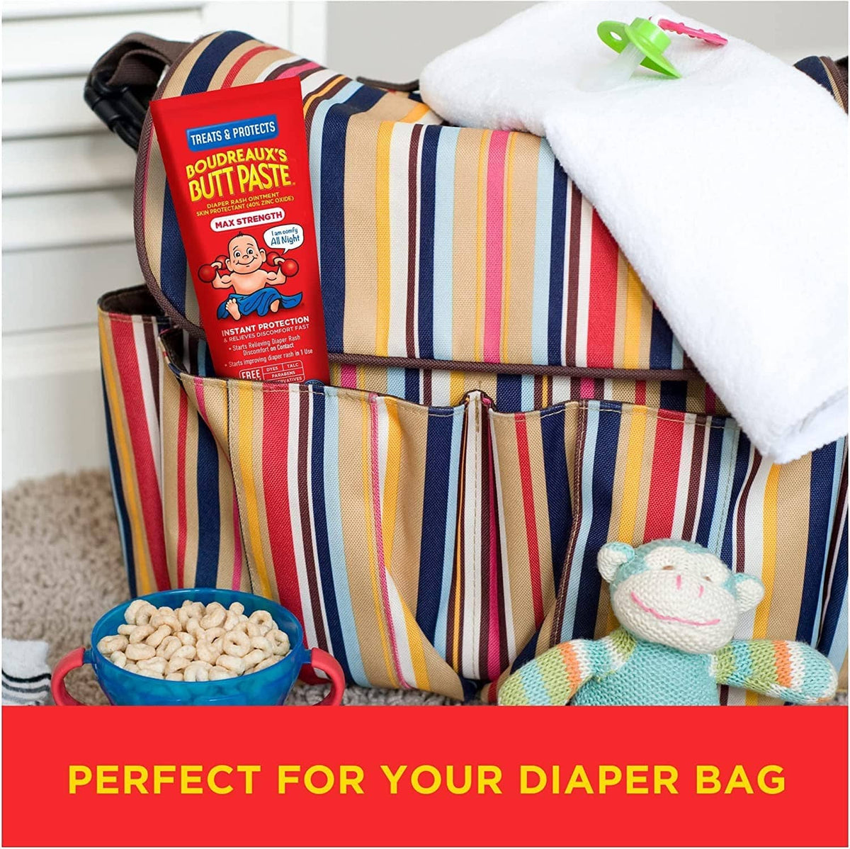 Diaper bag with Boudreaux’s Butt Paste Max Strength carton and striped organizer.
