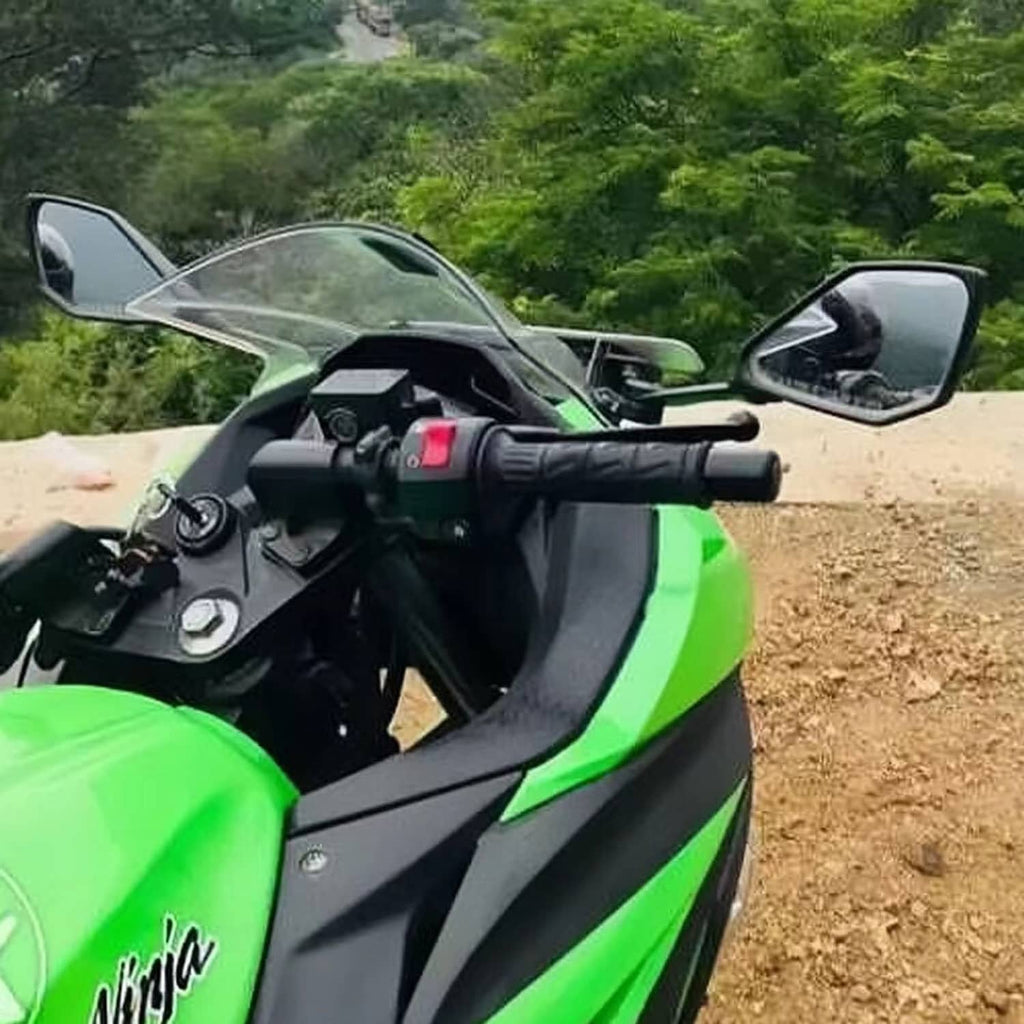 Installed black motorcycle rear-view mirror set on a green sport bike handlebar
