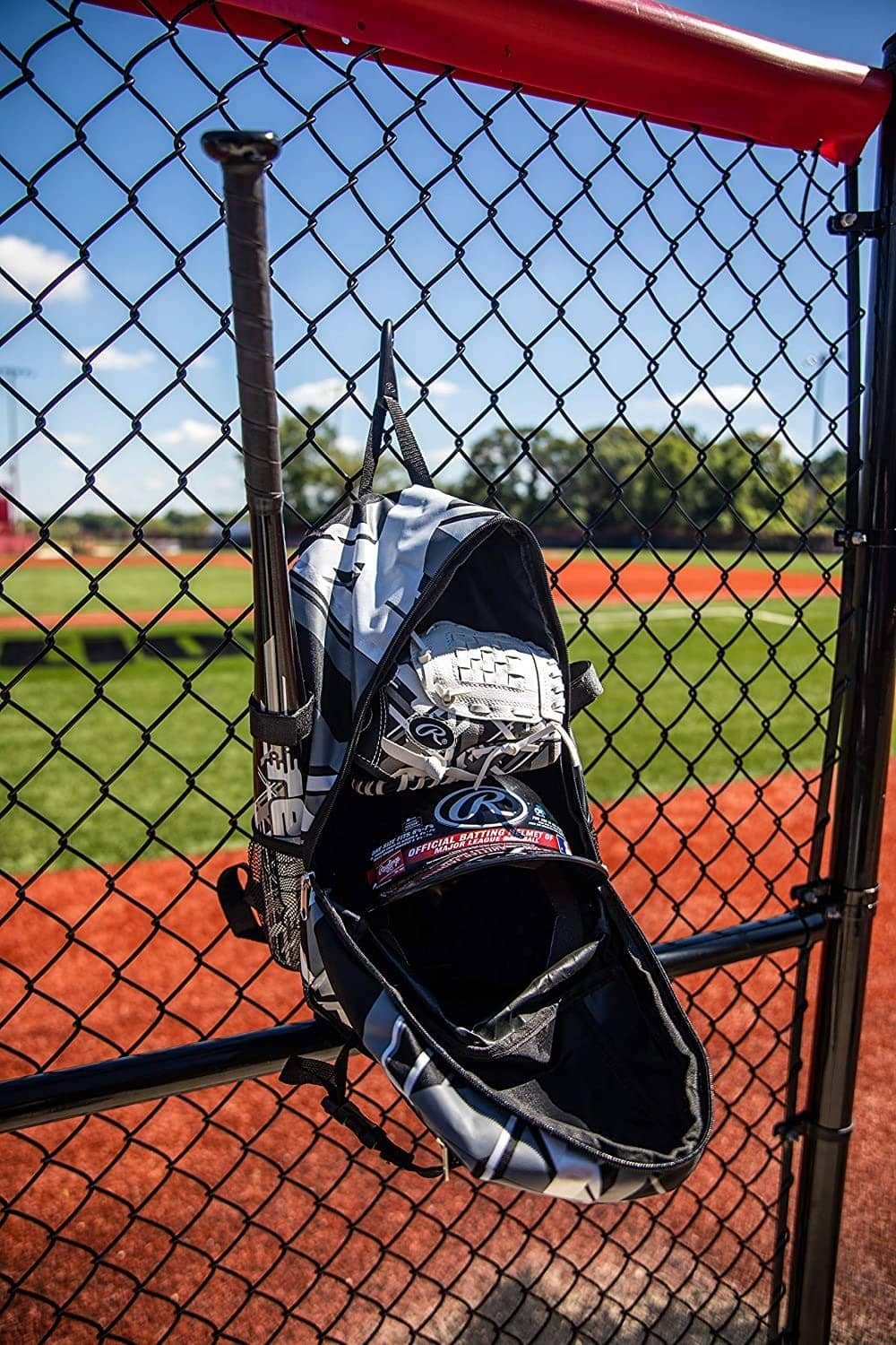 Baseball equipment backpack with black-and-white geometric print, bat holder, front logo pouch.