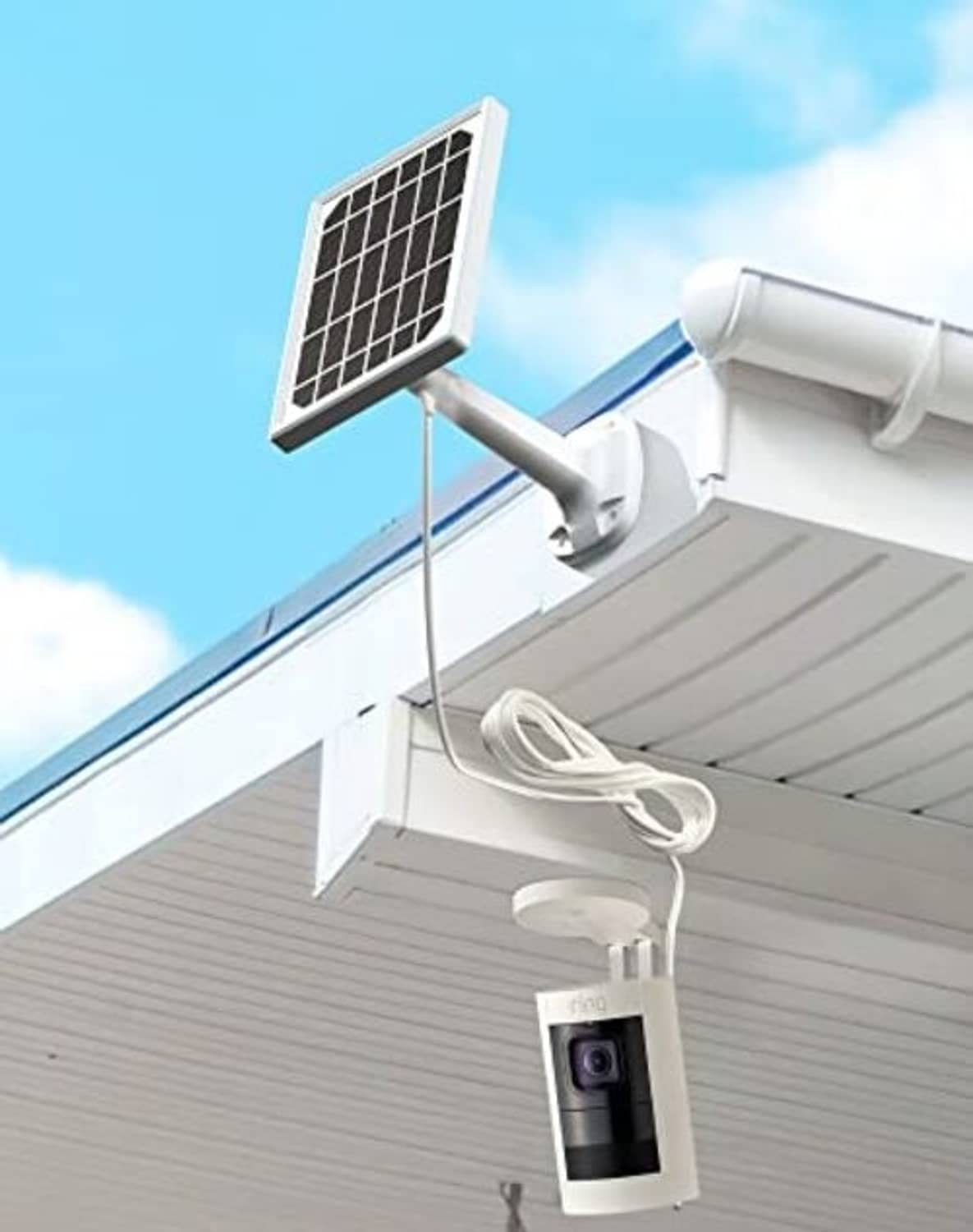 Solar panel charger with wall-mounted bracket, camera housing, and coiled power cable
