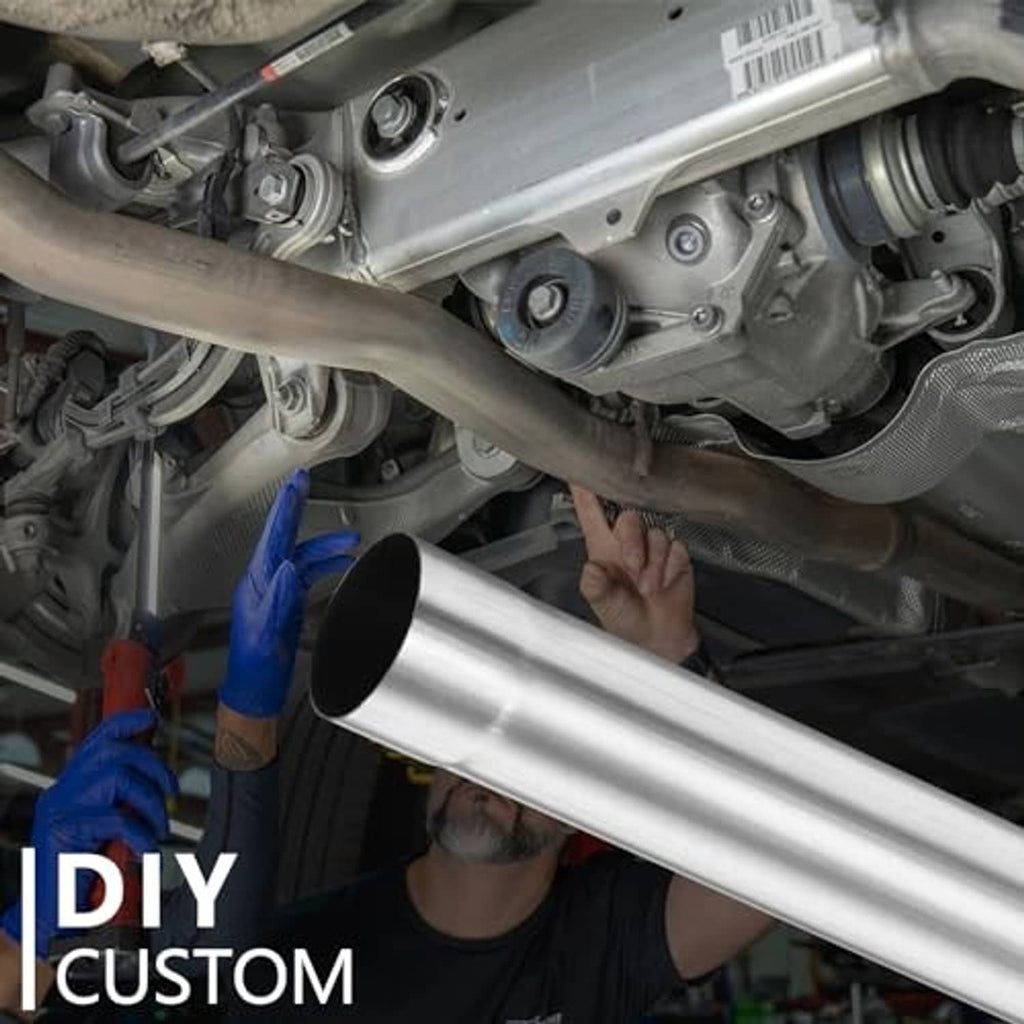 Straight stainless exhaust pipe being test-fit in engine bay, round black ends