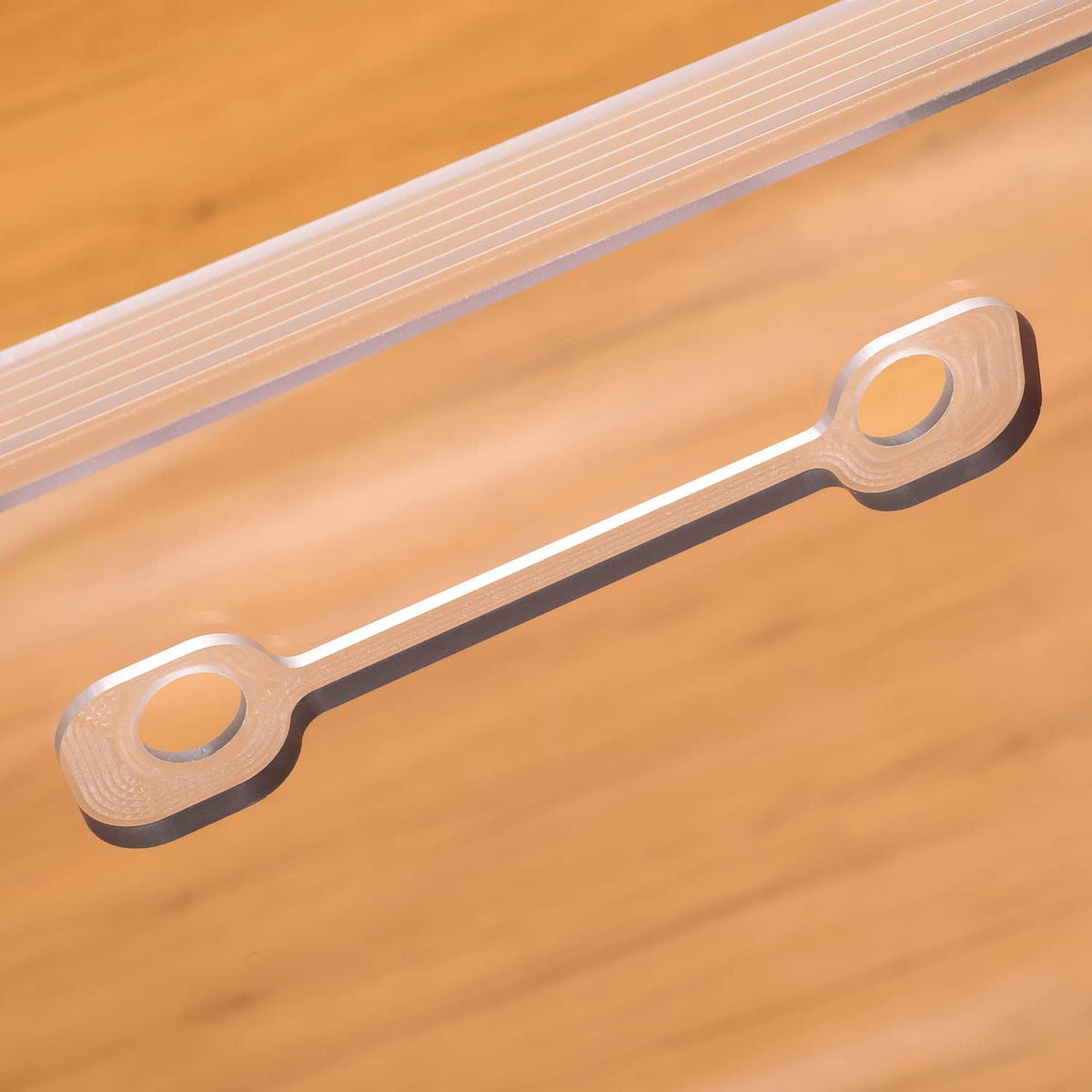 Door glass window mounting strip with circular hardware holes and slots