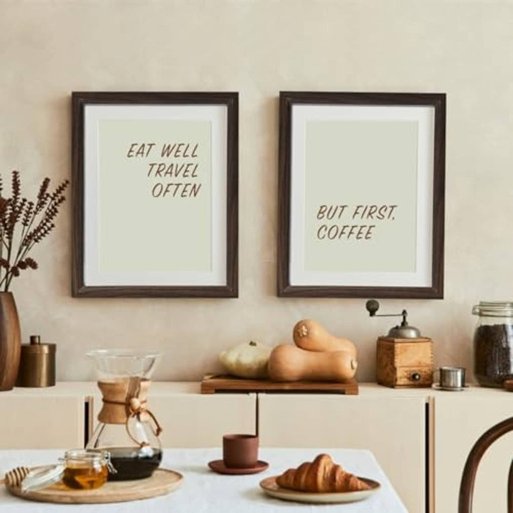 Two dark walnut picture frames on wall, quote prints with light background
