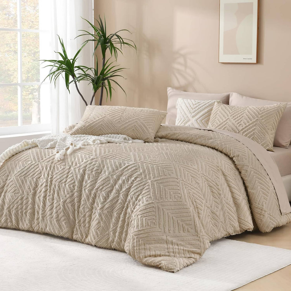 Quilted comforter set in light beige with geometric pattern and matching decorative shams