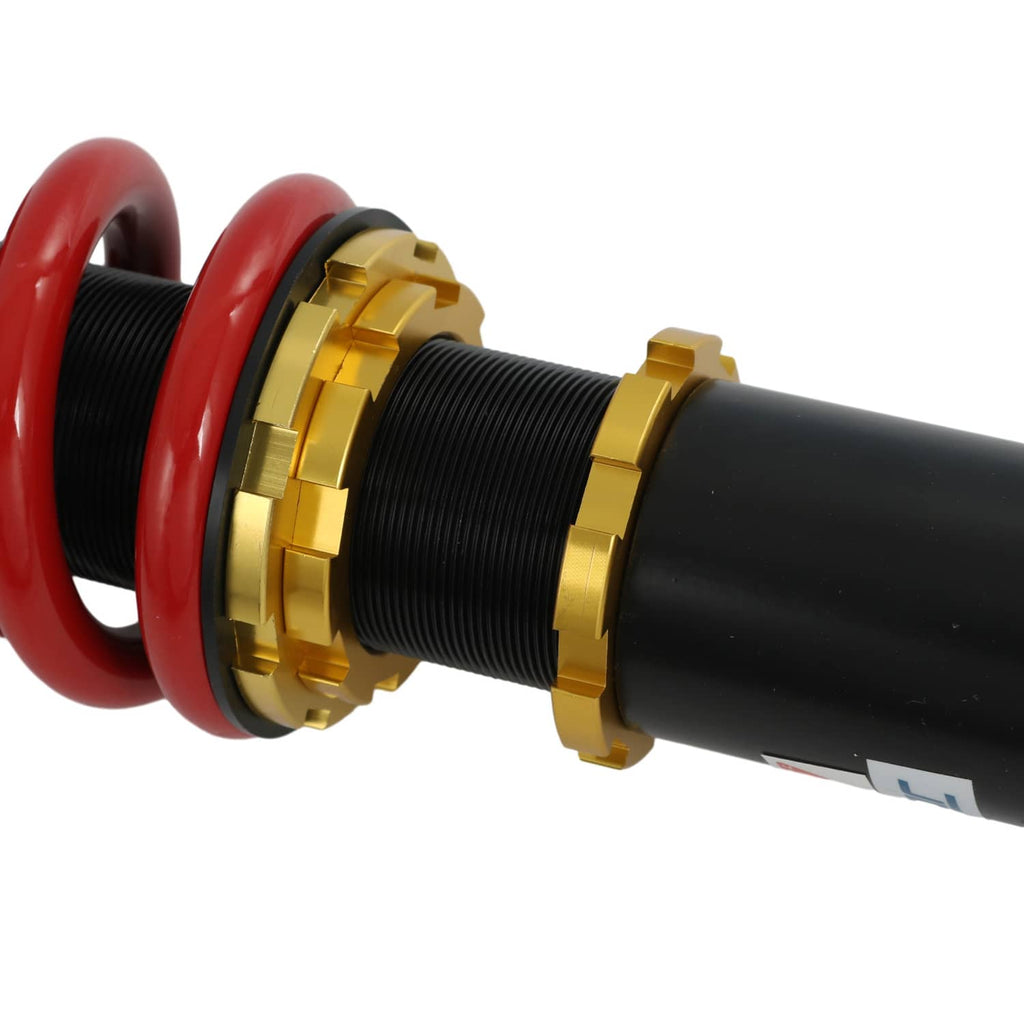 Coilover strut threaded shaft with black body and gold adjustment rings