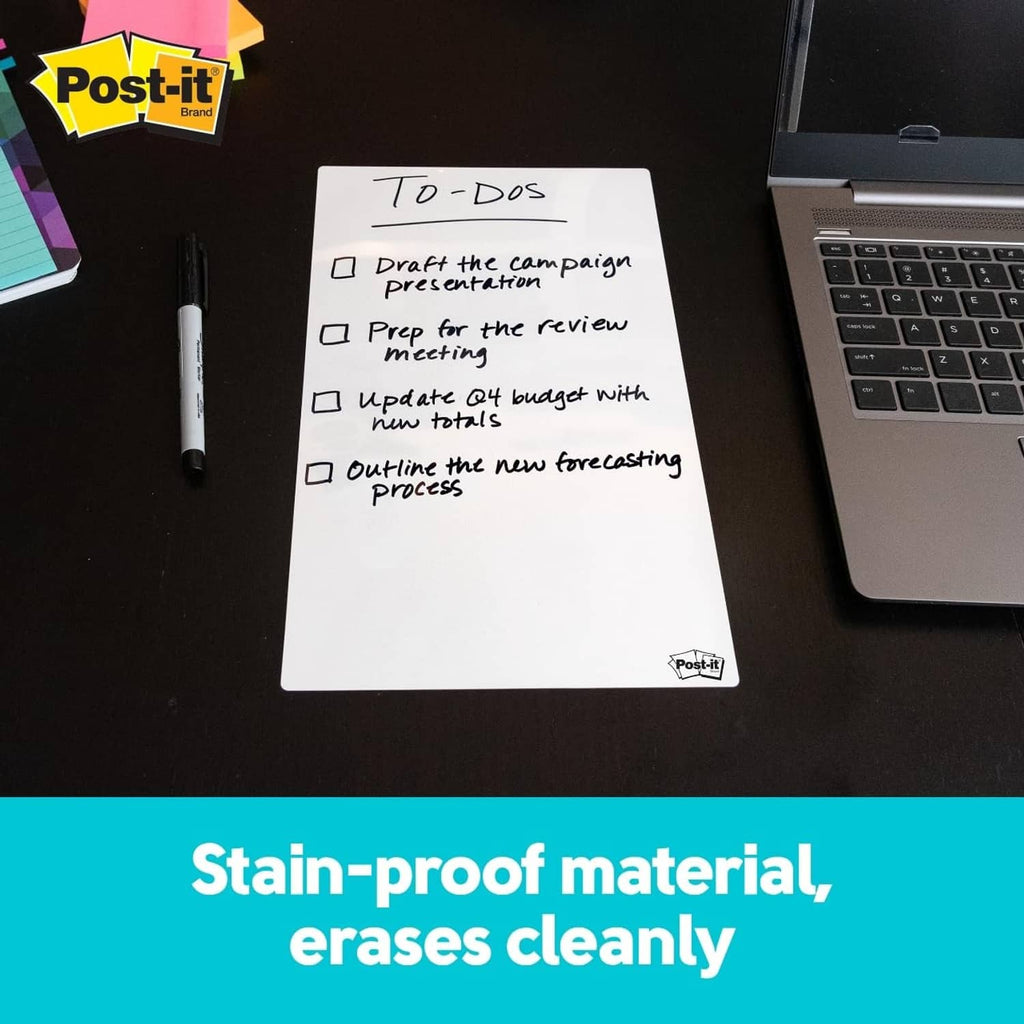 White dry erase note sheet with handwritten to-dos near a keyboard