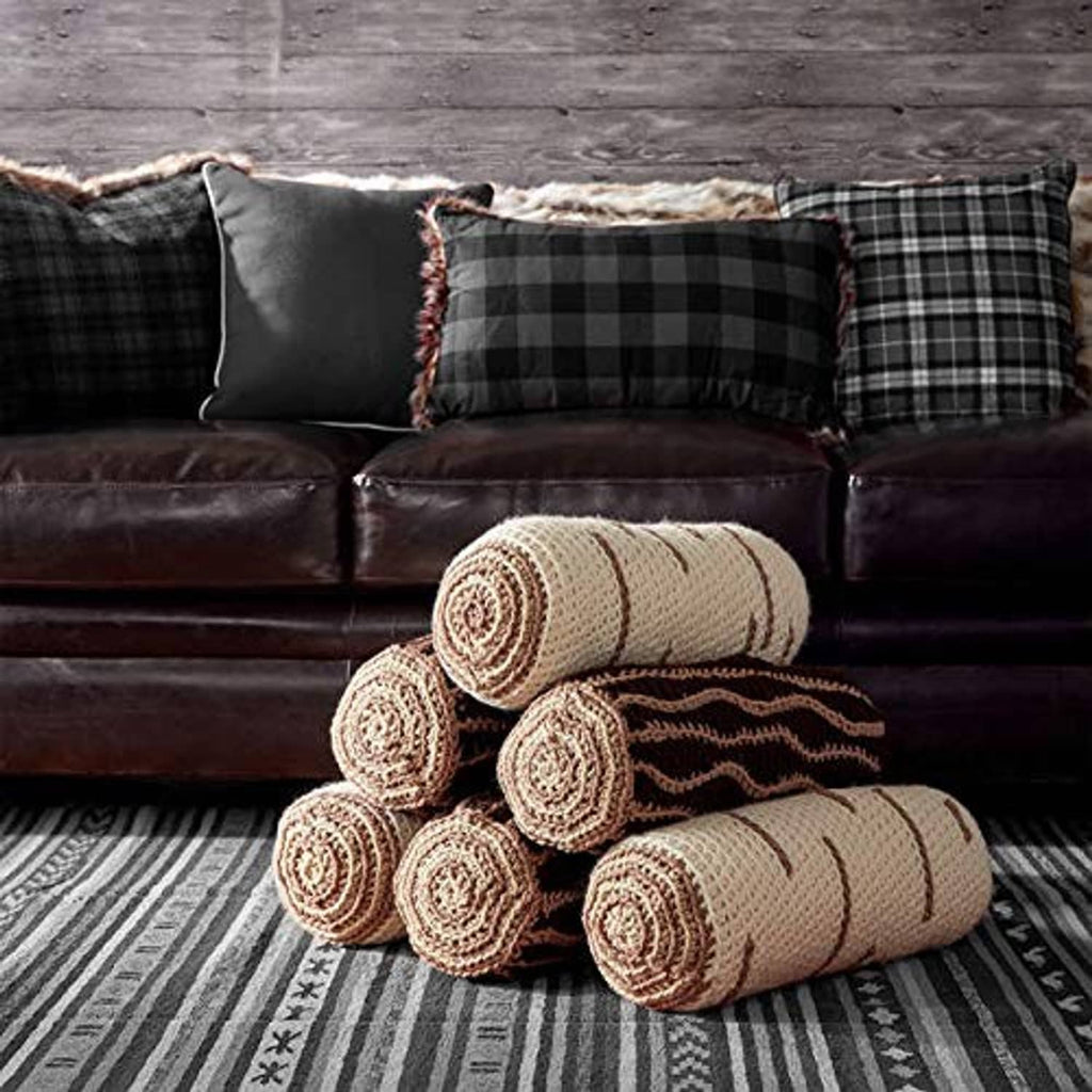 Rolled beige knit blankets with patterned stripes