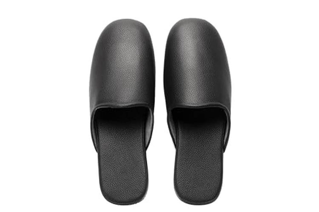 Black leather slip-on slippers viewed from above, open heel and wide vamp