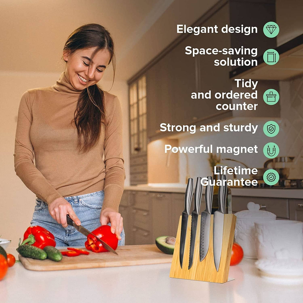 Coninx magnetic knife holder on countertop with several knives attached