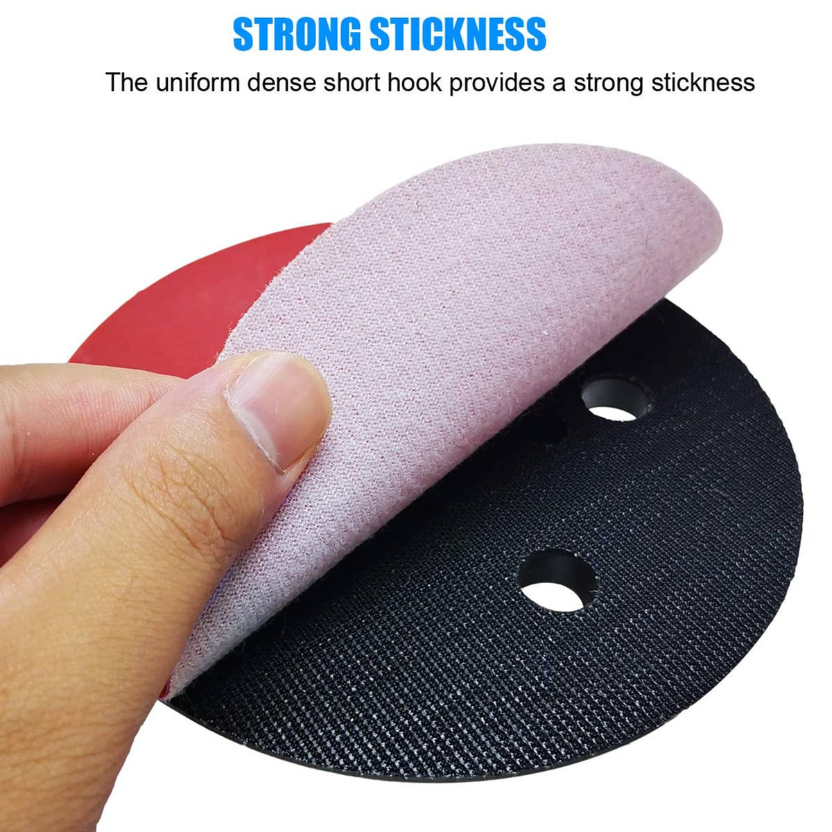 Hook-and-loop sanding pad with pink top layer and black backing ring, dust holes shown