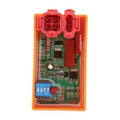 Orange CDI box with red terminals and green circuit board, front cover opened.