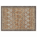 Large vintage-style area rug with distressed medallion border in brown, beige, teal