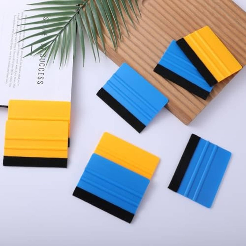 Assorted mini vinyl squeegees, 4-inch plastic scrapers with black felt edge in yellow and blue