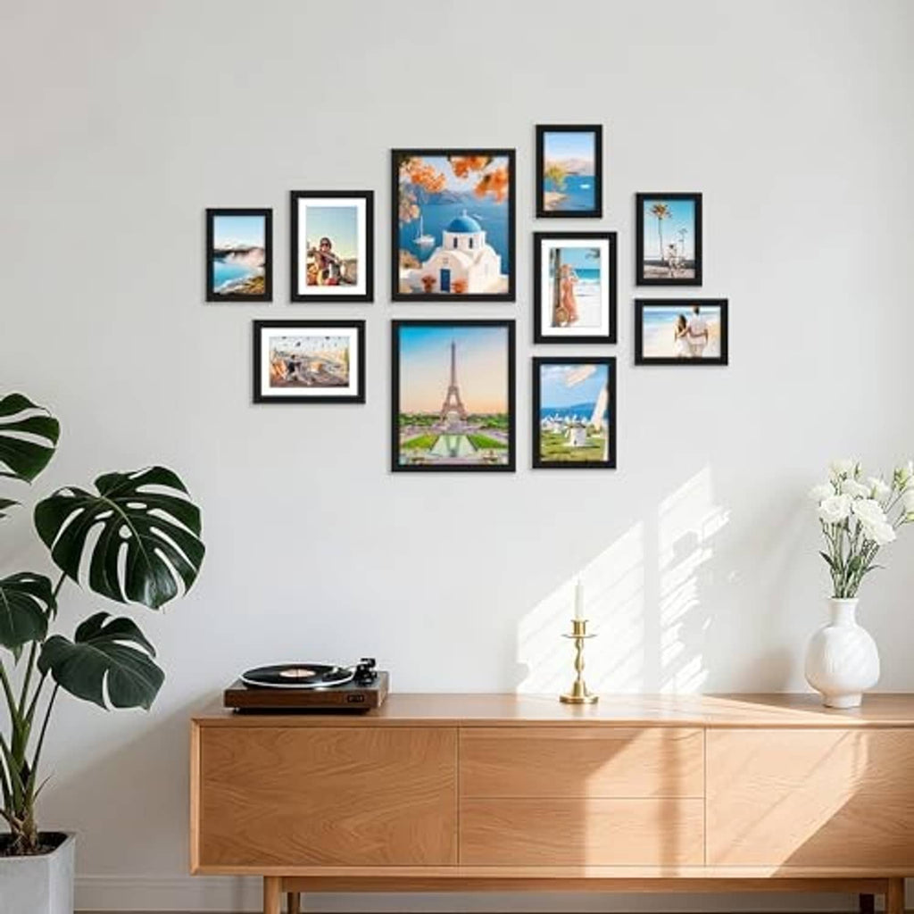 Black photo frame collage arrangement with mixed orientations on a wall