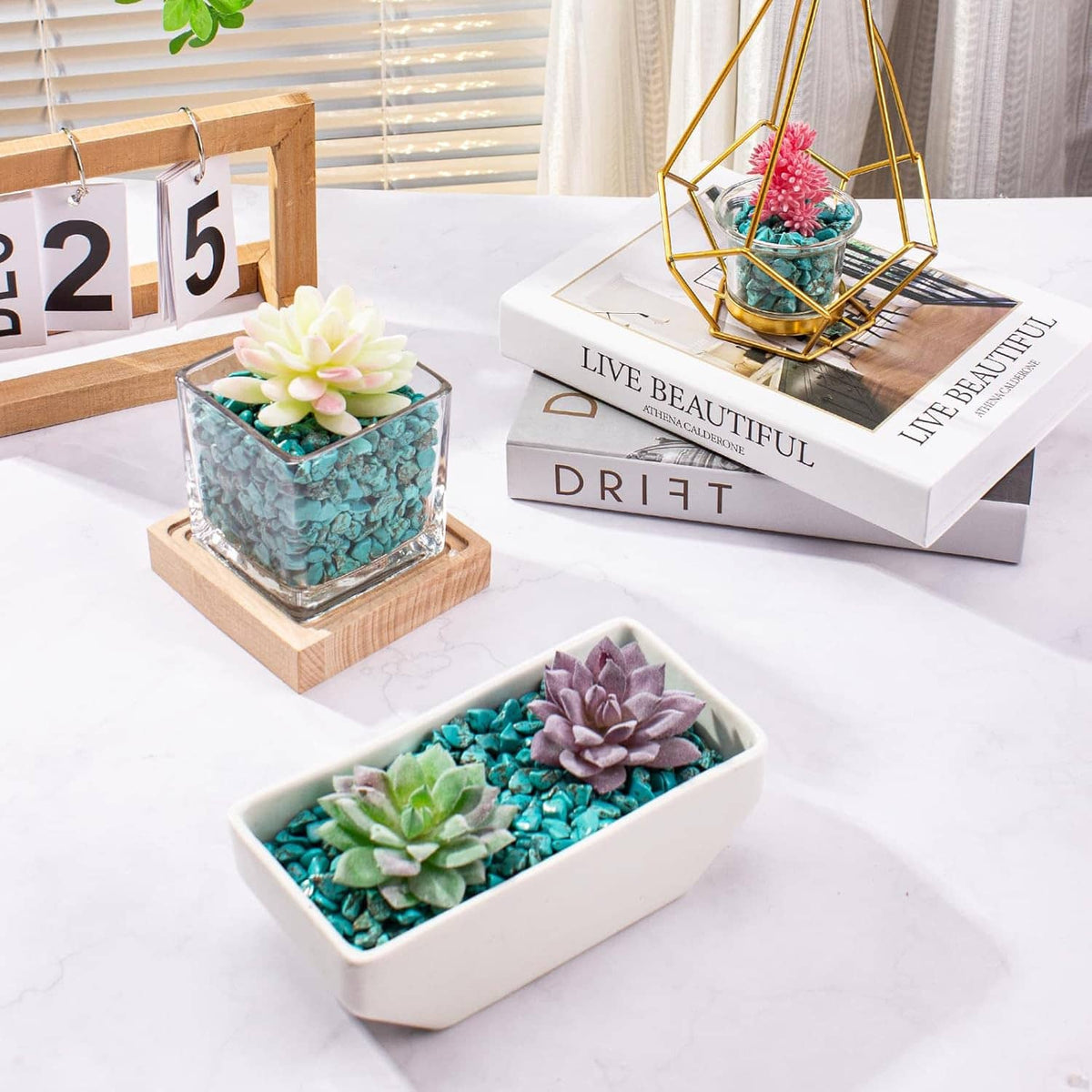 Turquoise howlite crystal chips in decorative glass jars and a white tray centerpiece
