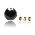 Black round shift knob with white 8 emblem, plus three copper thread adapters