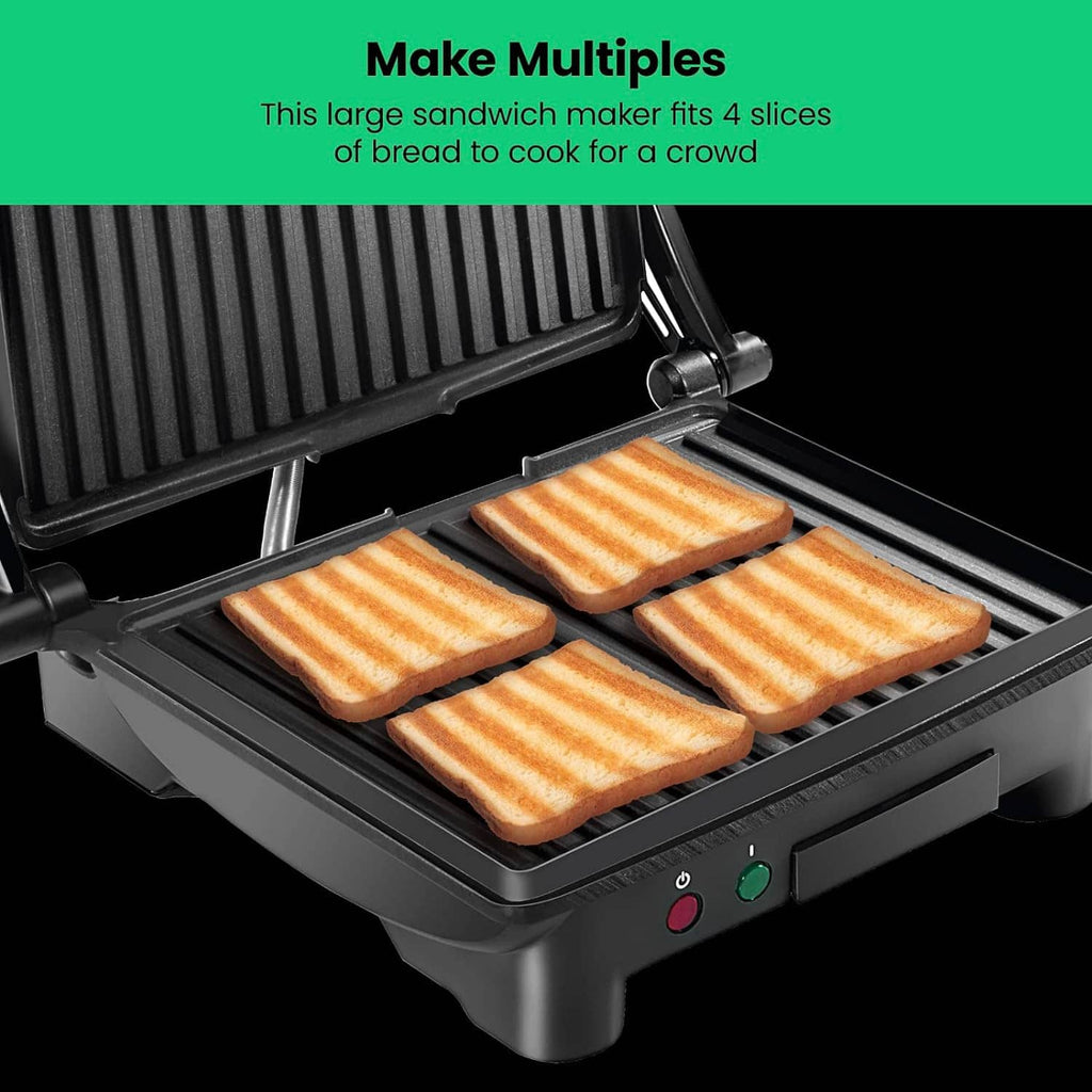 Four-slice panini press grill with ribbed top and flat bottom nonstick plates
