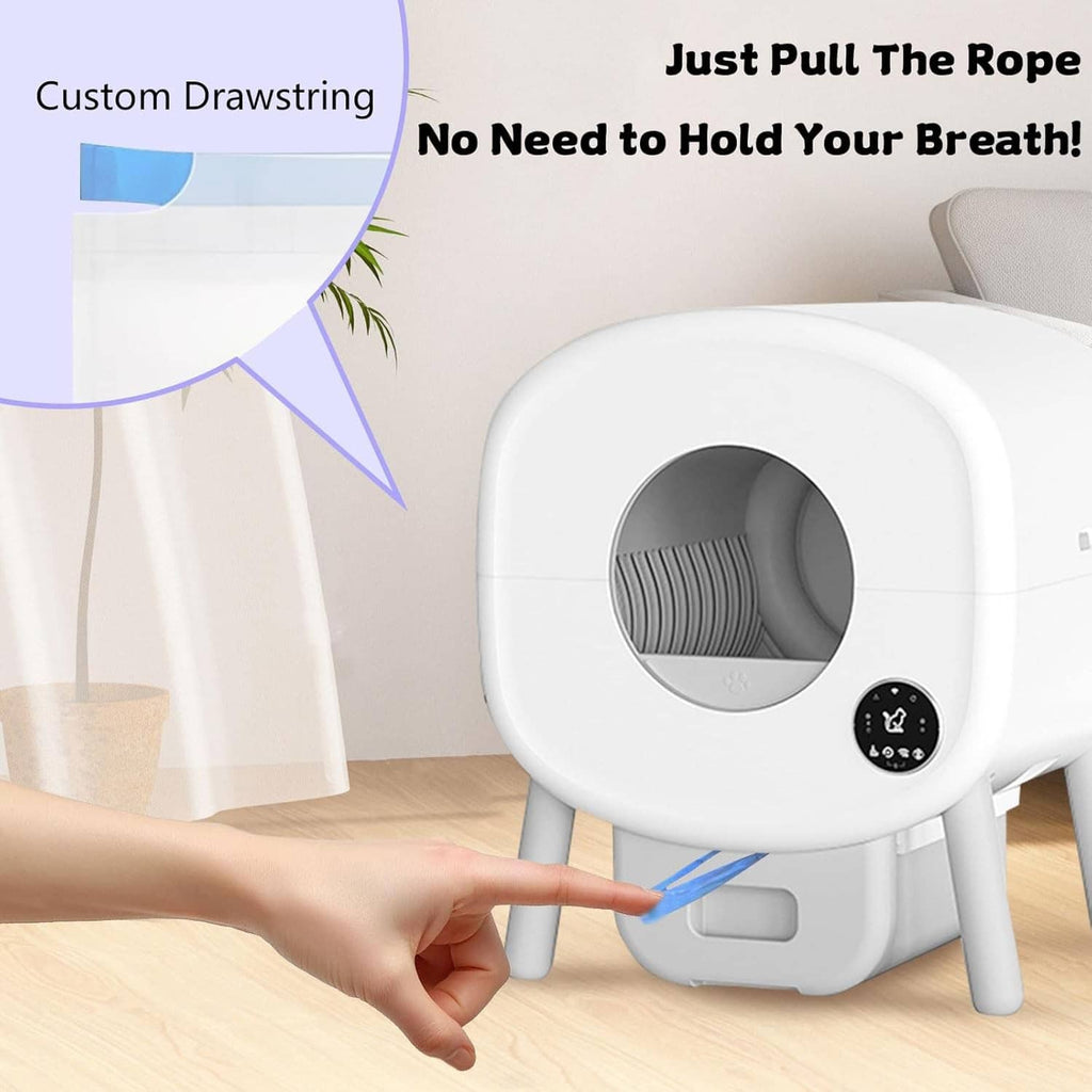 Blue liner rolls beside white self-cleaning cat litter box, pull-through design