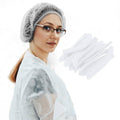Disposable white bouffant cap hair net with gathered elastic edge