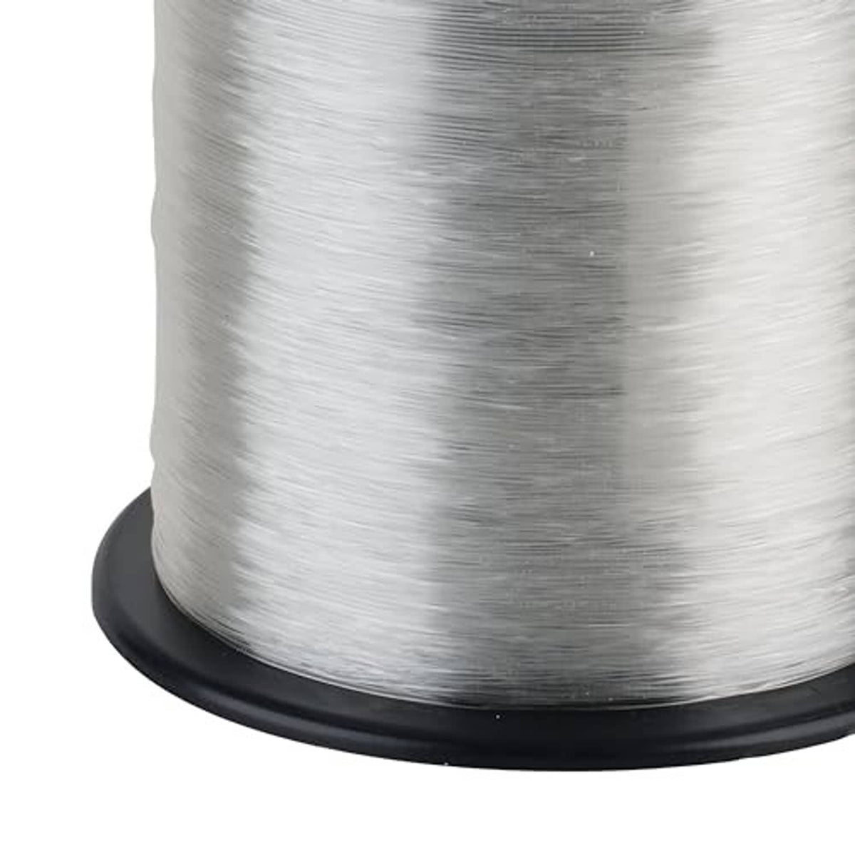 Close-up of clear fluorocarbon fishing line wound on spool, light gray/white strand