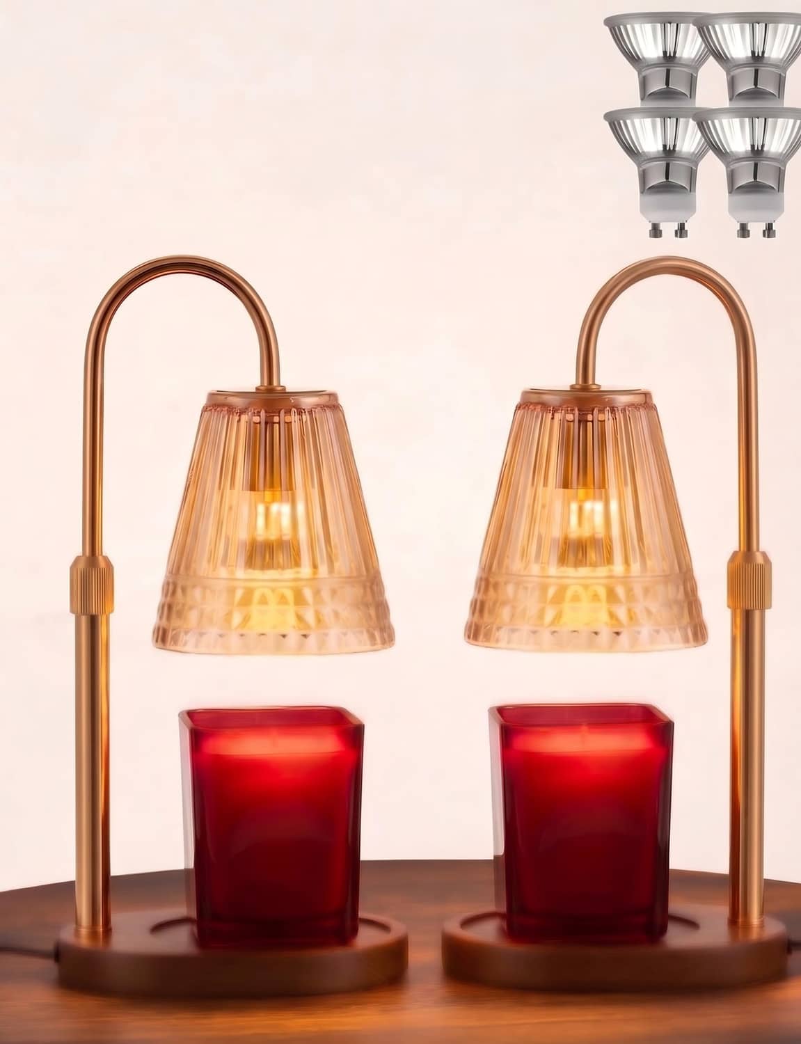 Gold candle warmer lamp with metal stand and glass dome warming a candle jar